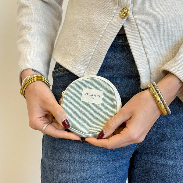Model with the DE LA MUR Striped Round Coin Purse – Light Green & Green (Teo)