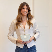 Model with the DE LA MUR Striped Small Makeup Bag – Light Green & Green (Teo)
