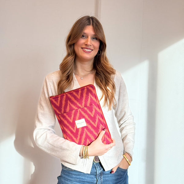 Model with the DE LA MUR Zigzag Jacquard Padded Laptop Bag – Pink & Orange (Fuego)