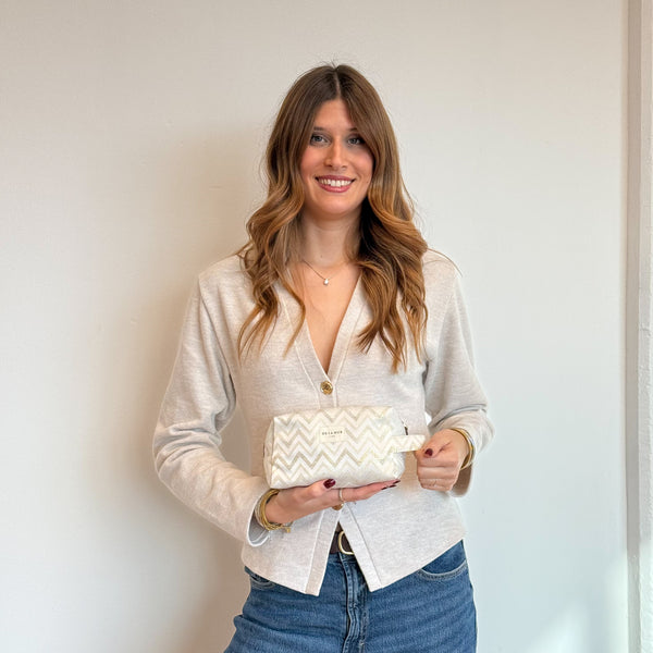 Model with the DE LA MUR Zigzag Squared Makeup Bag – Gold & Off-White (Astro)