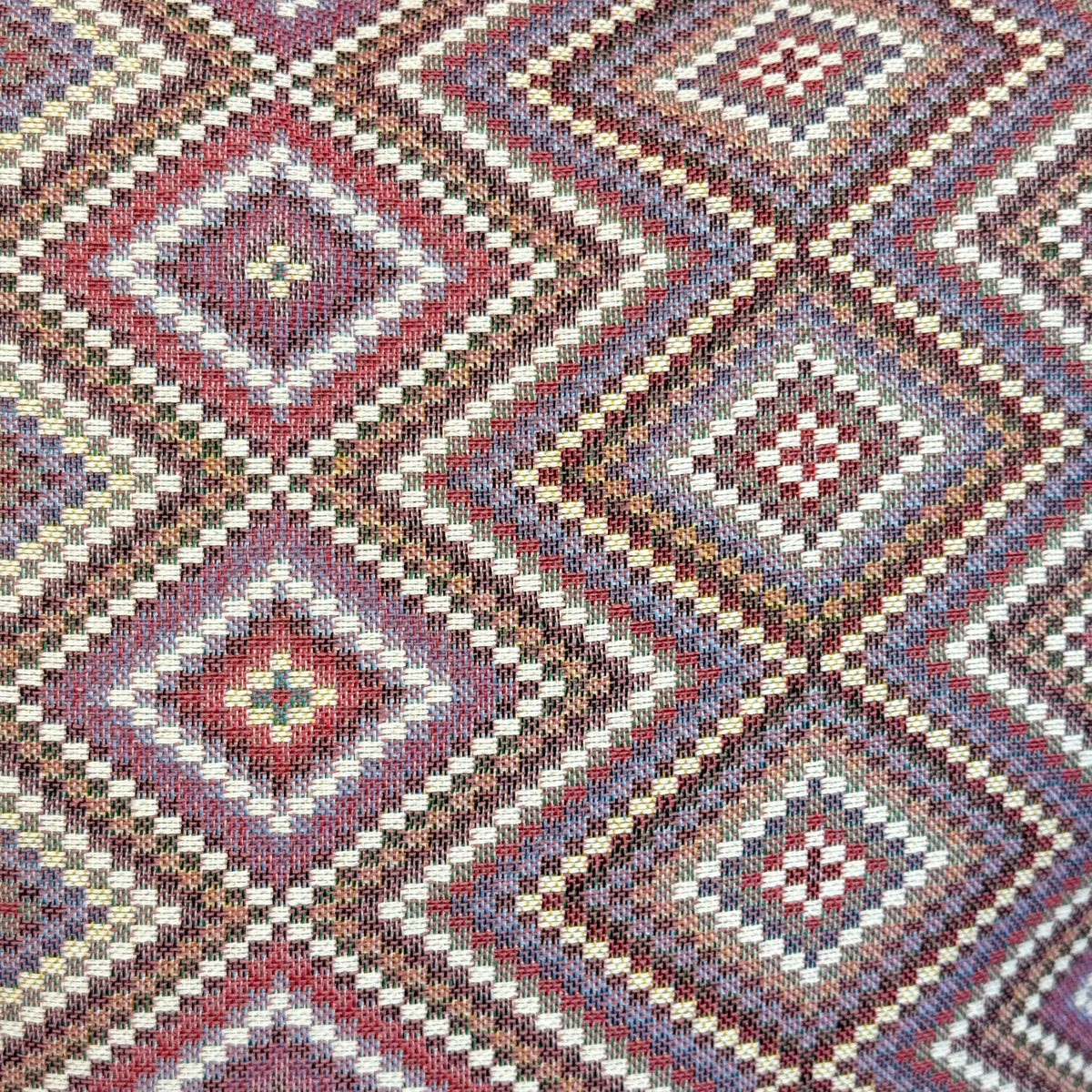 Close-up of the lilac diamond jacquard weave on the DE LA MUR Nana bag