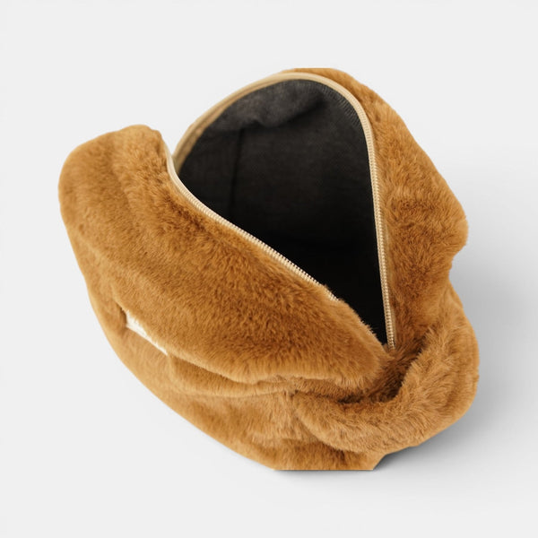 Open DE LA MUR faux fur makeup bag showing the black lined interior