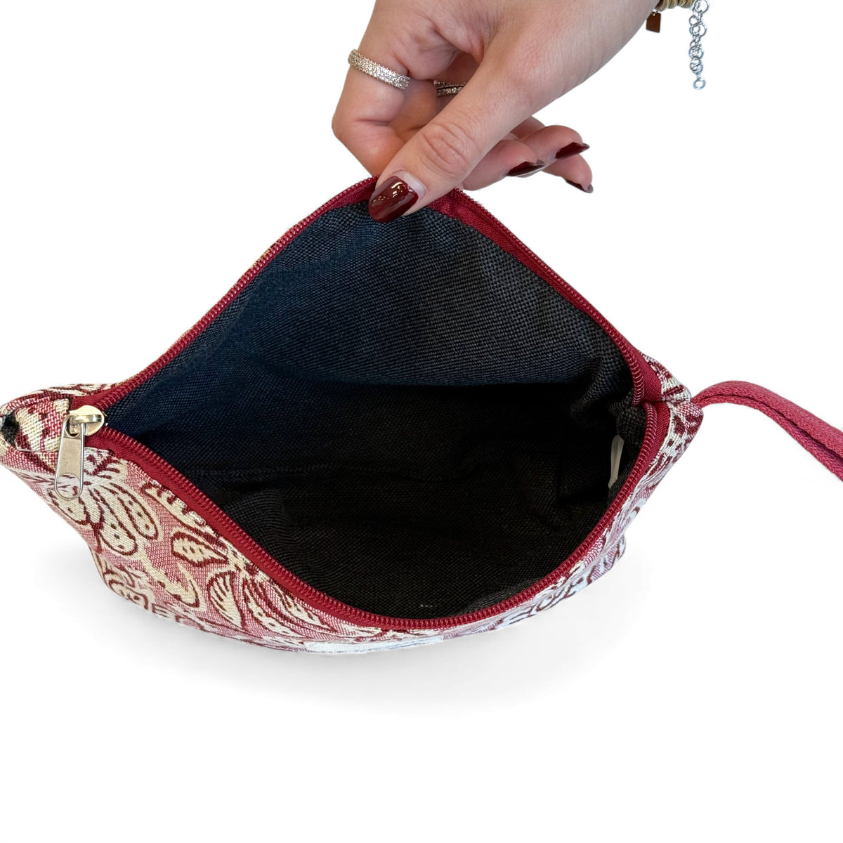 Open DE LA MUR Came floral makeup bag showing the dark lined interior