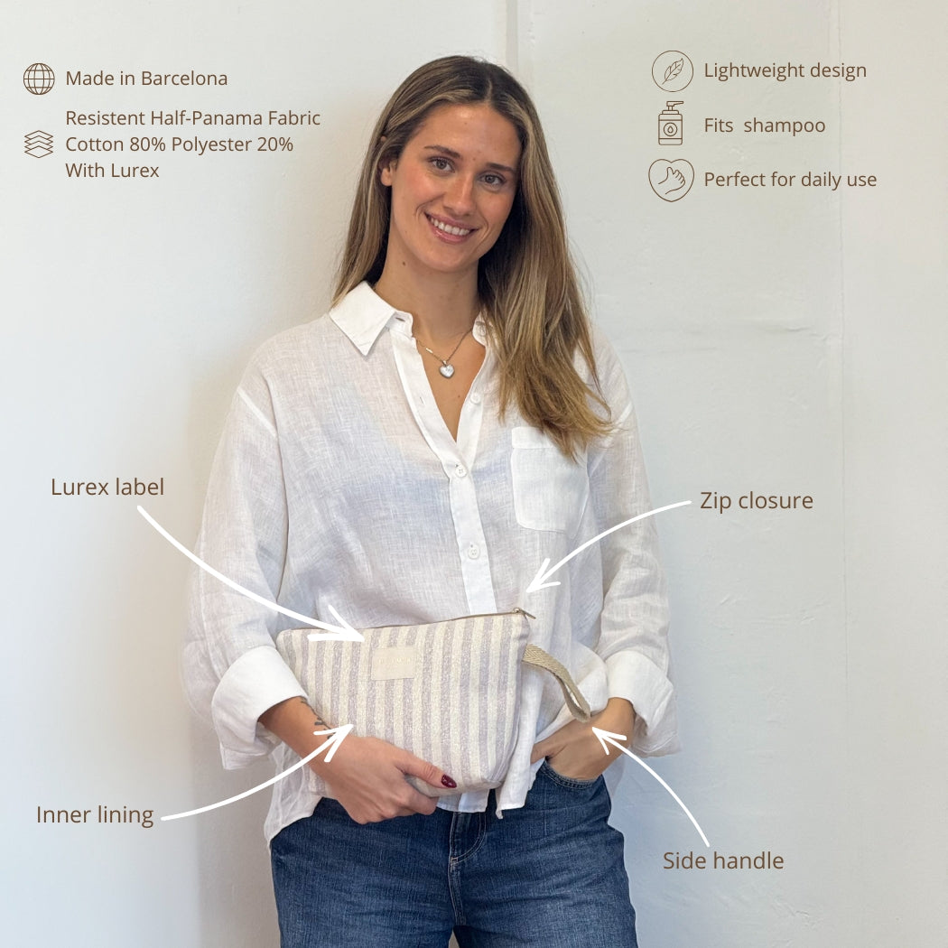 Model holding the DE LA MUR Lulil striped makeup bag with labeled features infographic
