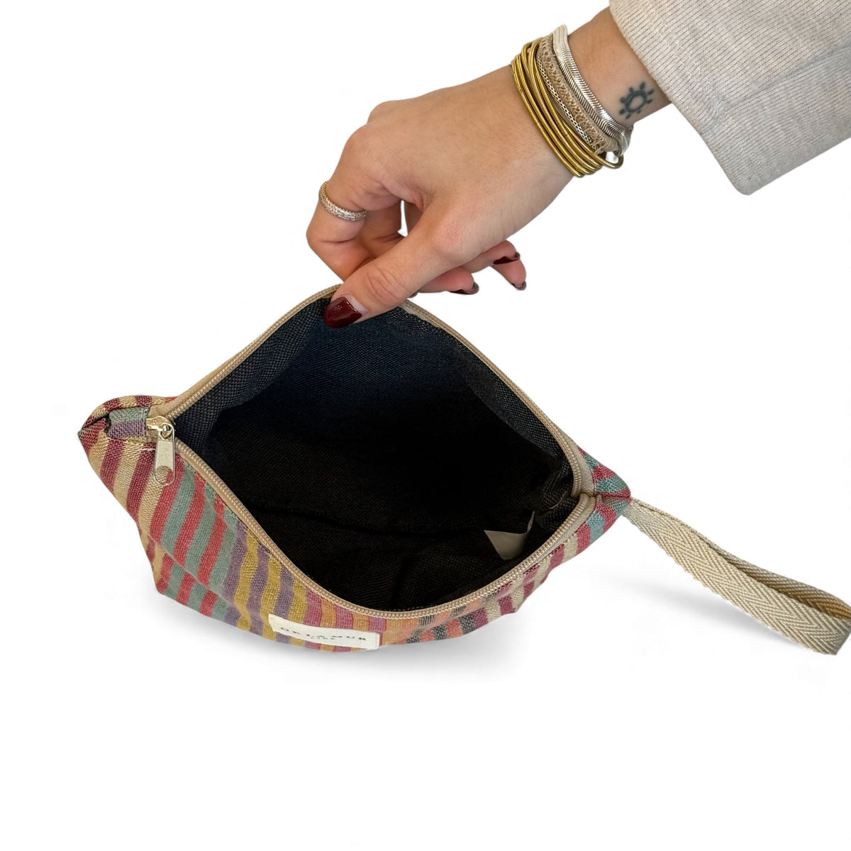 Open DE LA MUR Maria striped jacquard makeup bag showing black lined interior