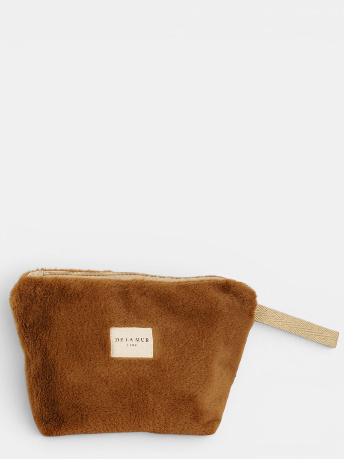 DE LA MUR Faux Fur Large Makeup Bag in camel brown, front view with wrist strap