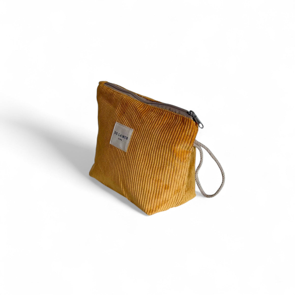 DE LA MUR Taz mustard corduroy makeup bag, three-quarter side view