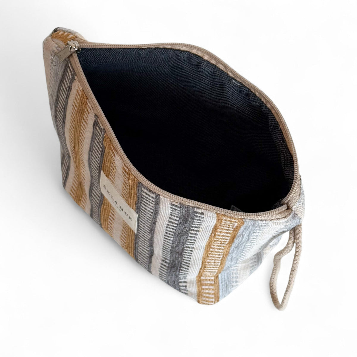 Open Tron striped jacquard makeup bag showing the dark lined interior