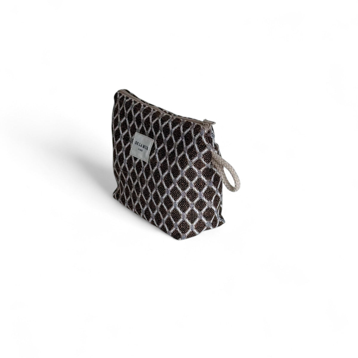 DE LA MUR Cobre diamond jacquard small makeup bag, three-quarter side view with zip and loop