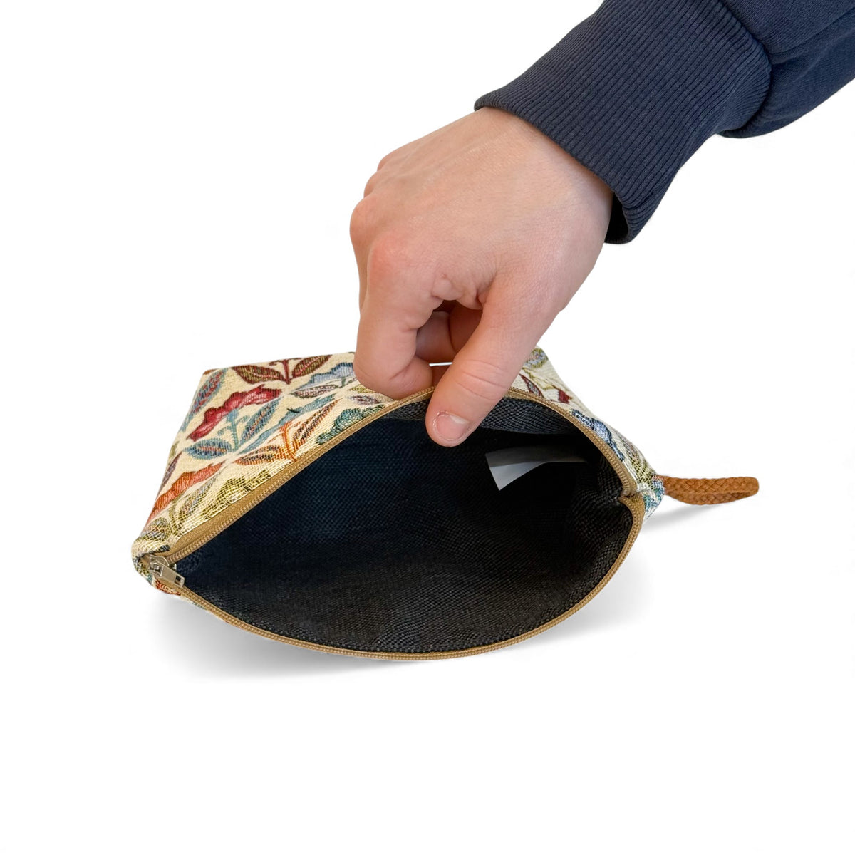 Open DE LA MUR floral jacquard makeup bag showing the dark lined interior