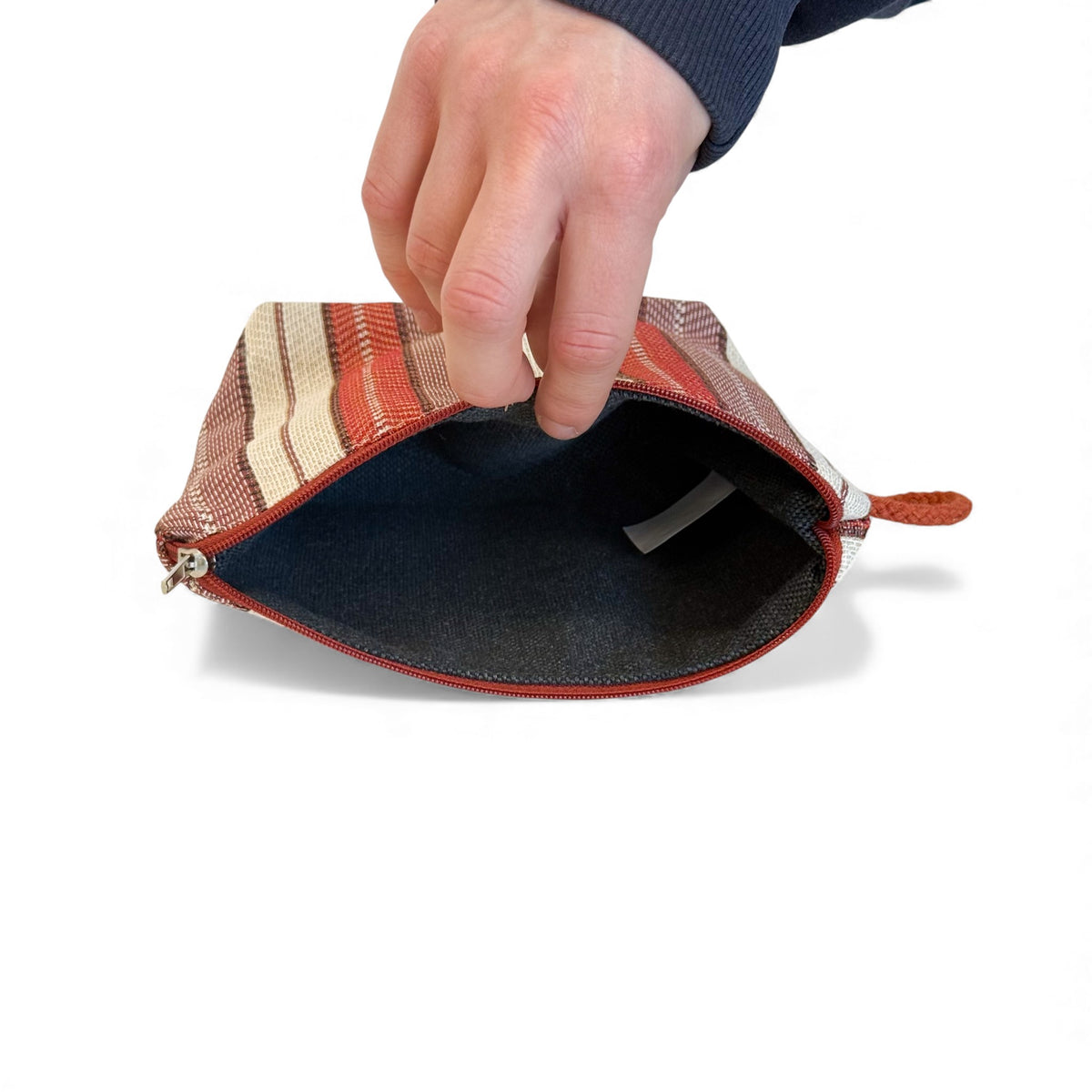 Open DE LA MUR Make makeup bag showing the dark lined interior and zip
