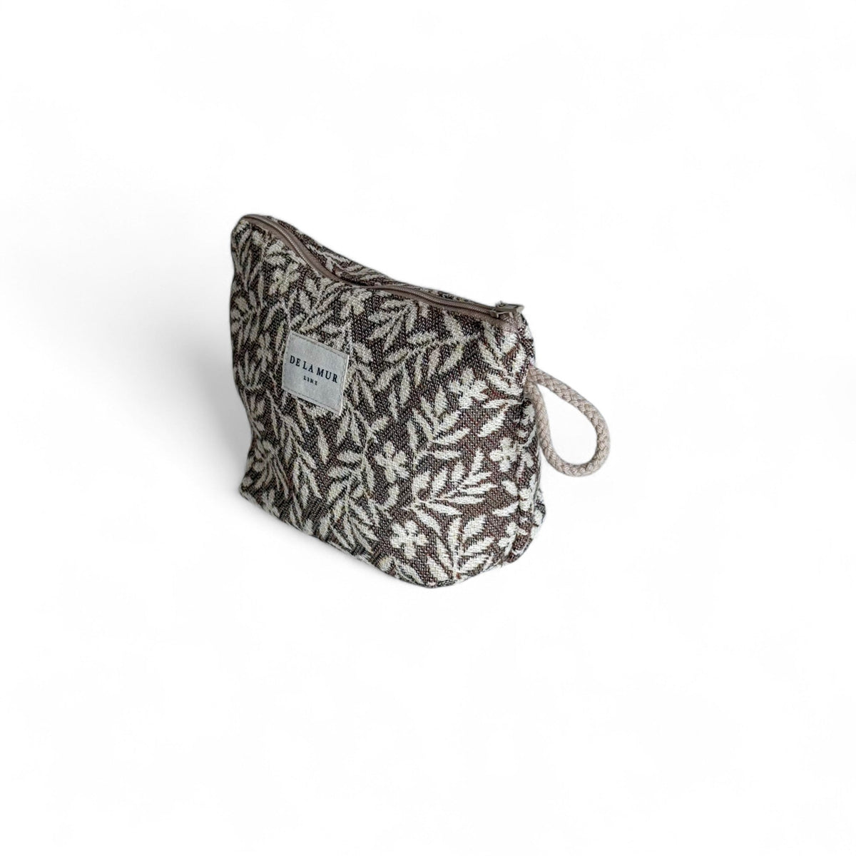 DE LA MUR Plan floral jacquard small makeup bag, three-quarter side view with zip closure