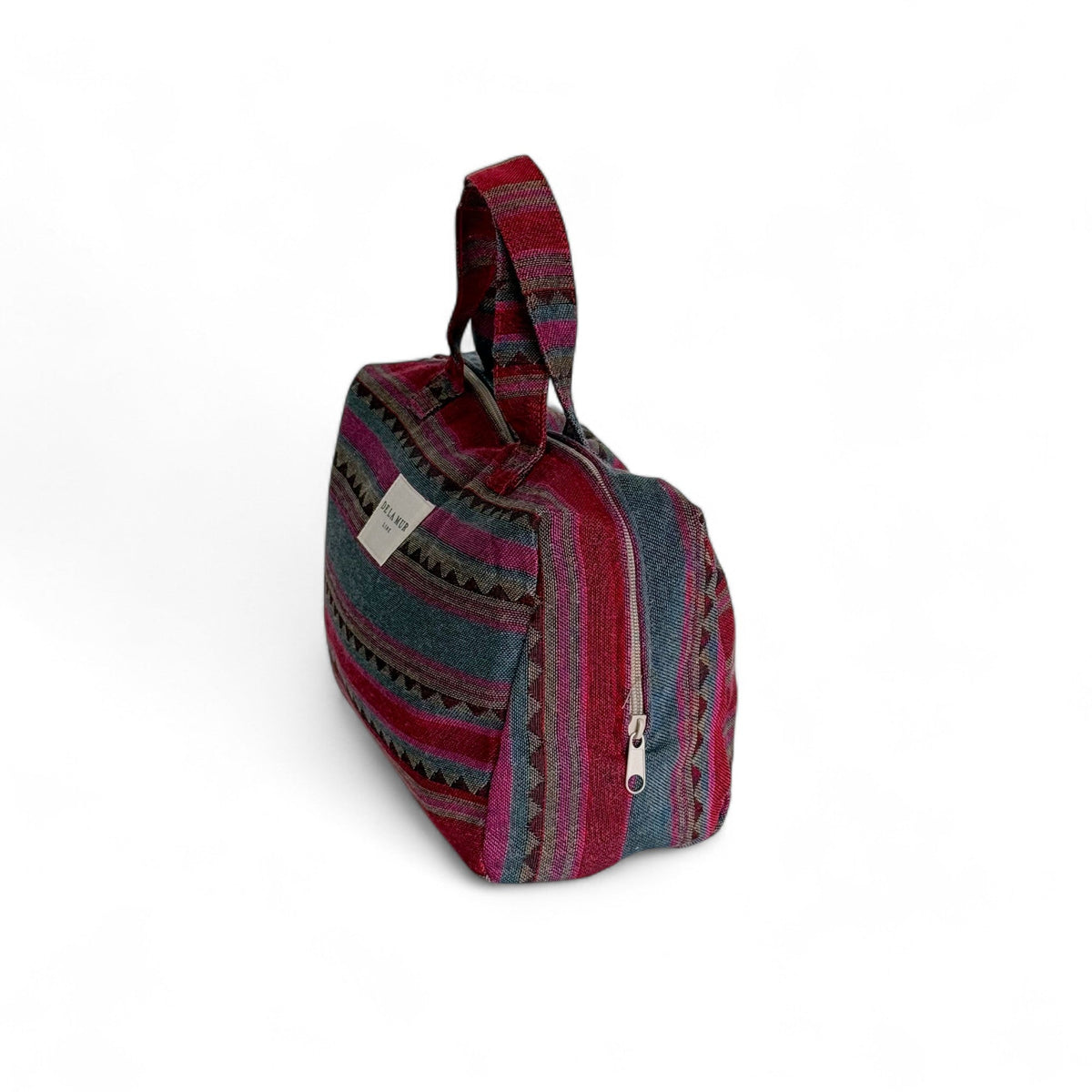 DE LA MUR Aura XL makeup bag, side view showing zip closure and woven stripes