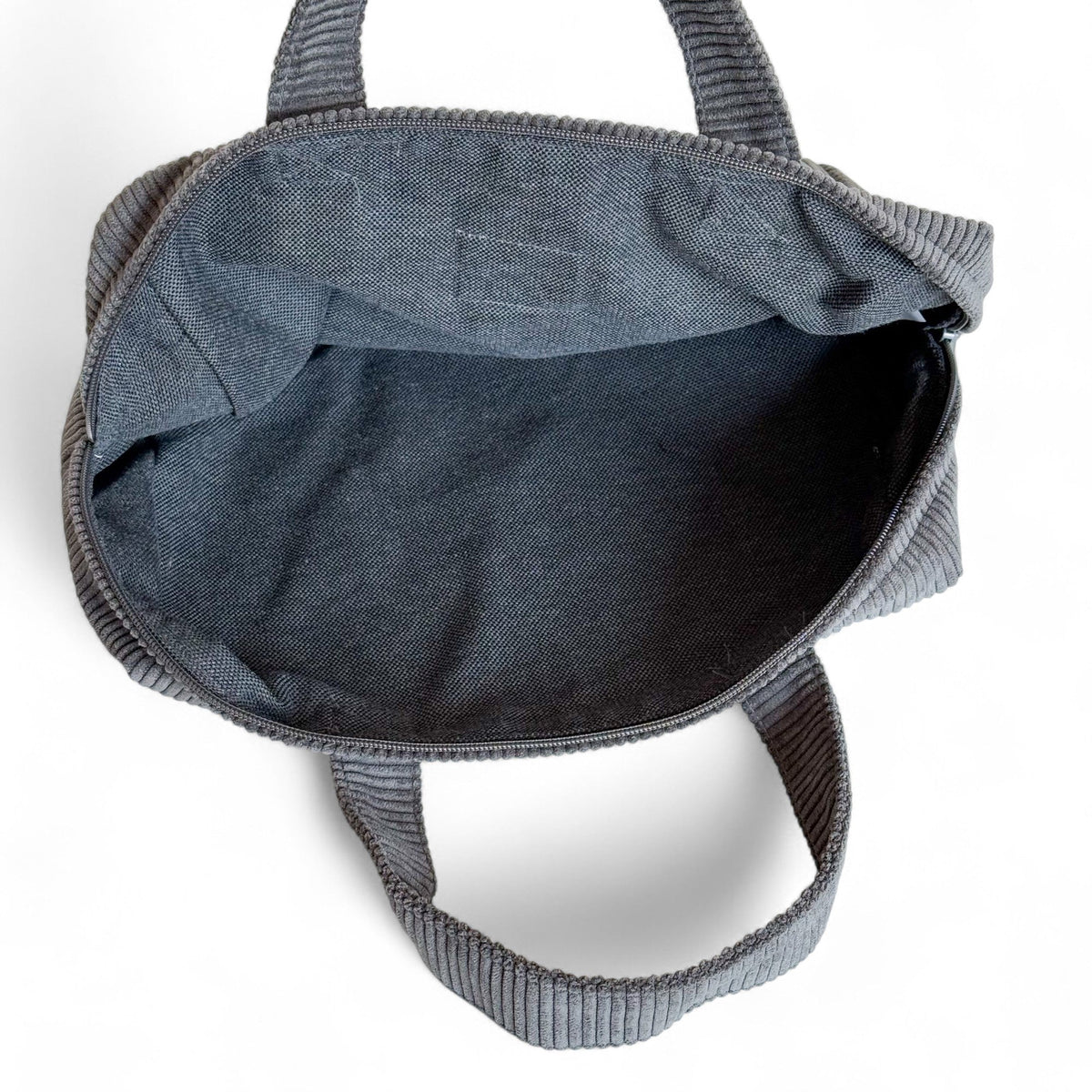 Open DE LA MUR Boni gray corduroy XL makeup bag showing the lined interior