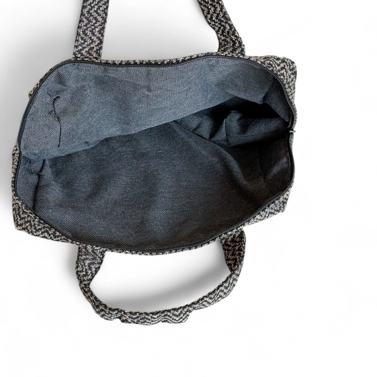Open DE LA MUR Dana zigzag XL makeup bag showing the grey lined interior