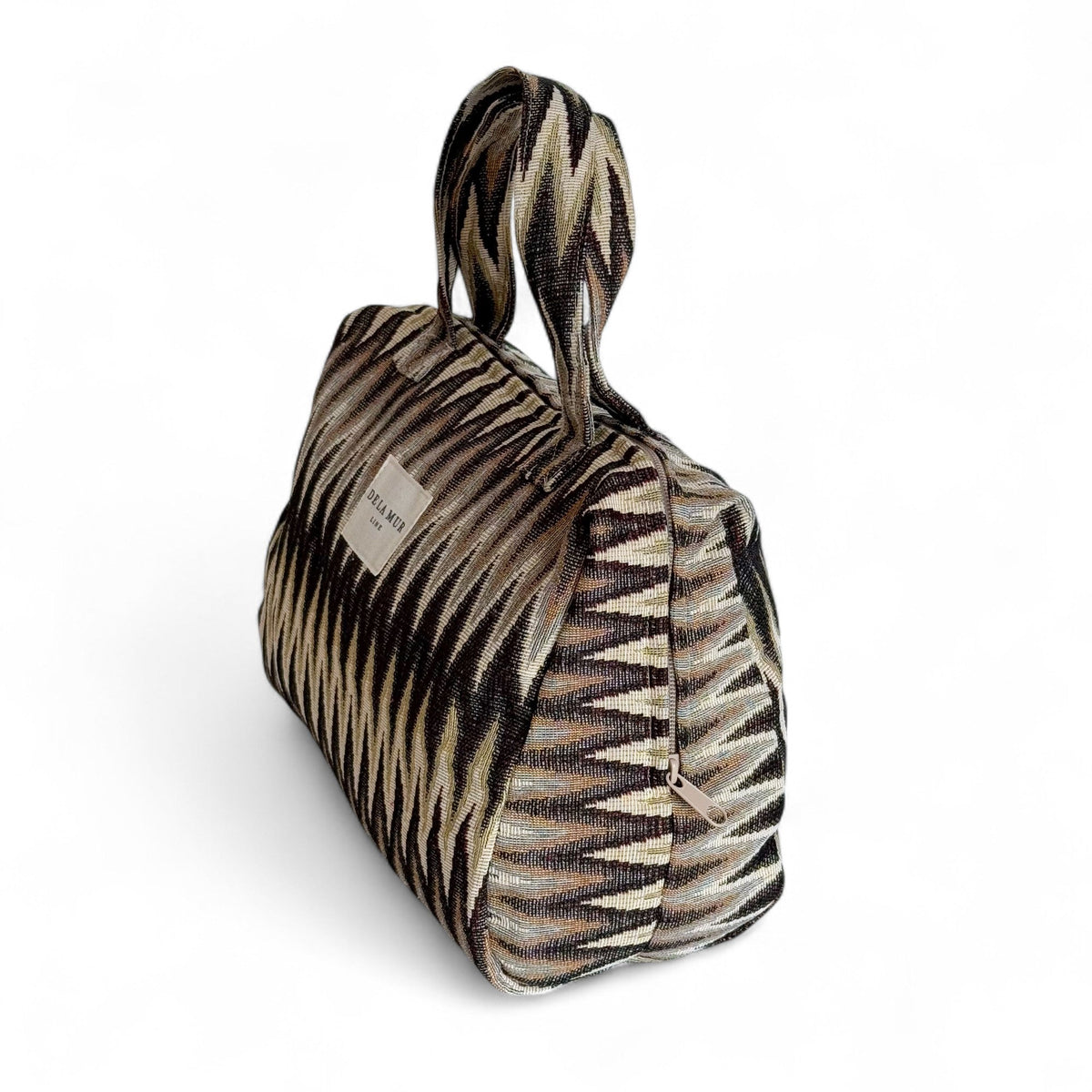 DE LA MUR Skan zigzag jacquard XL makeup bag, three-quarter side view showing depth and zip