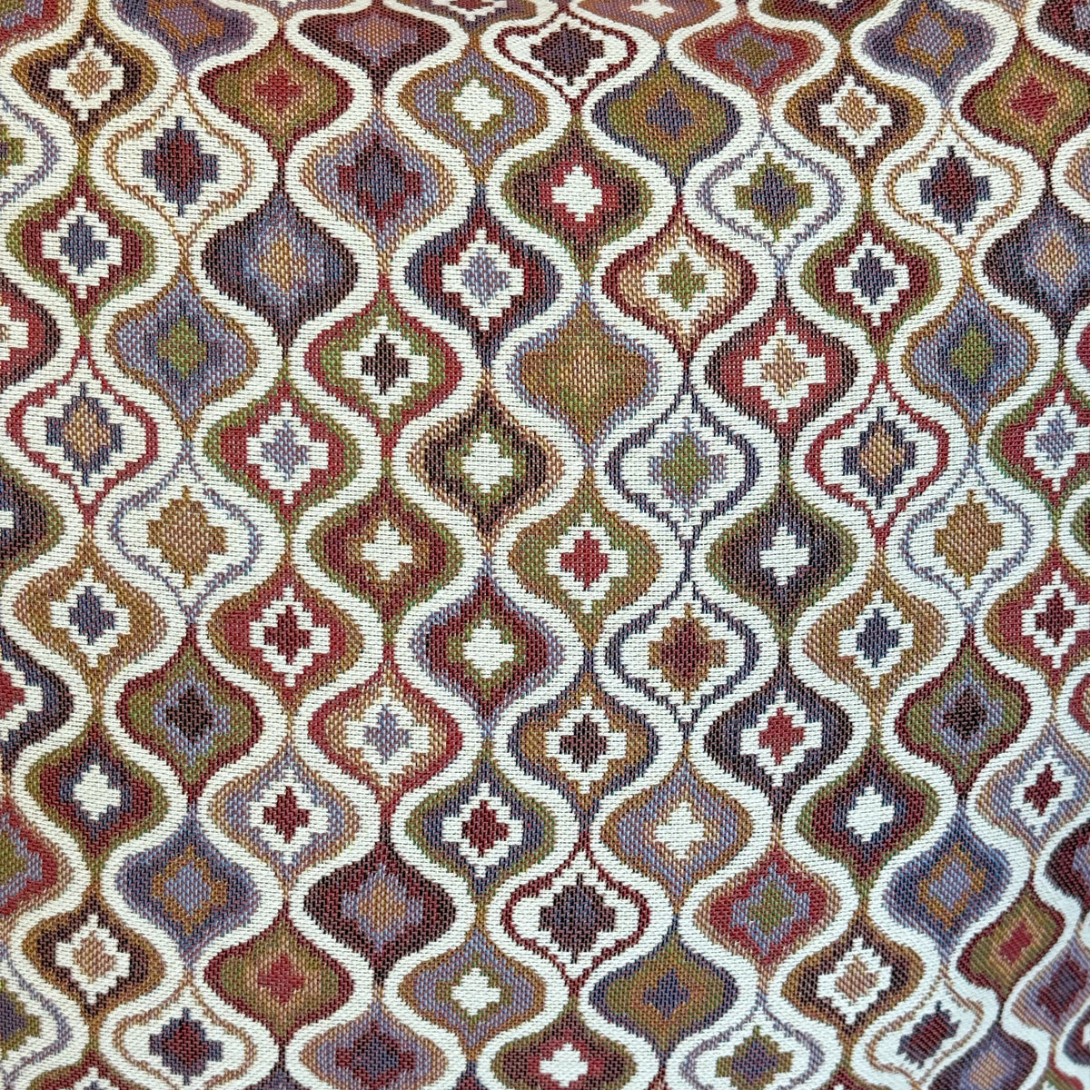 Close-up of the warm multicolor ogee geometric jacquard fabric, DE LA MUR Onda