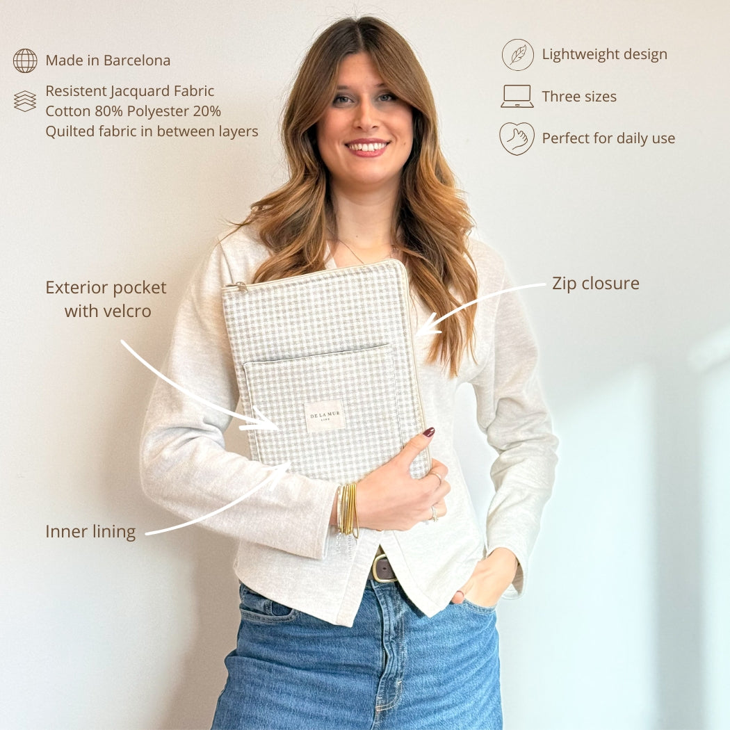 Model holding DE LA MUR Vison laptop bag with features infographic and specs