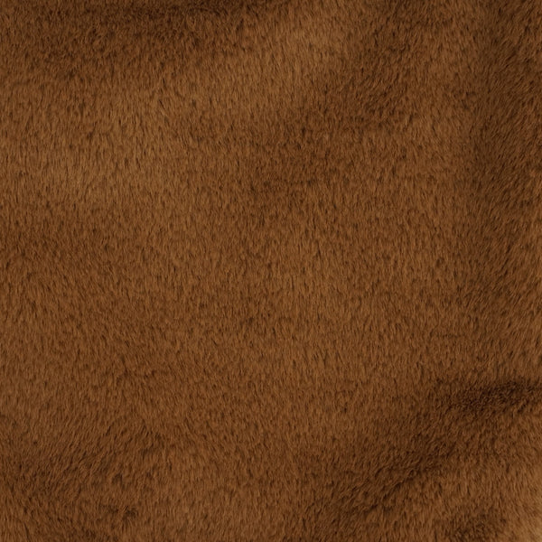 Close-up of the soft camel brown faux fur of the DE LA MUR makeup bag