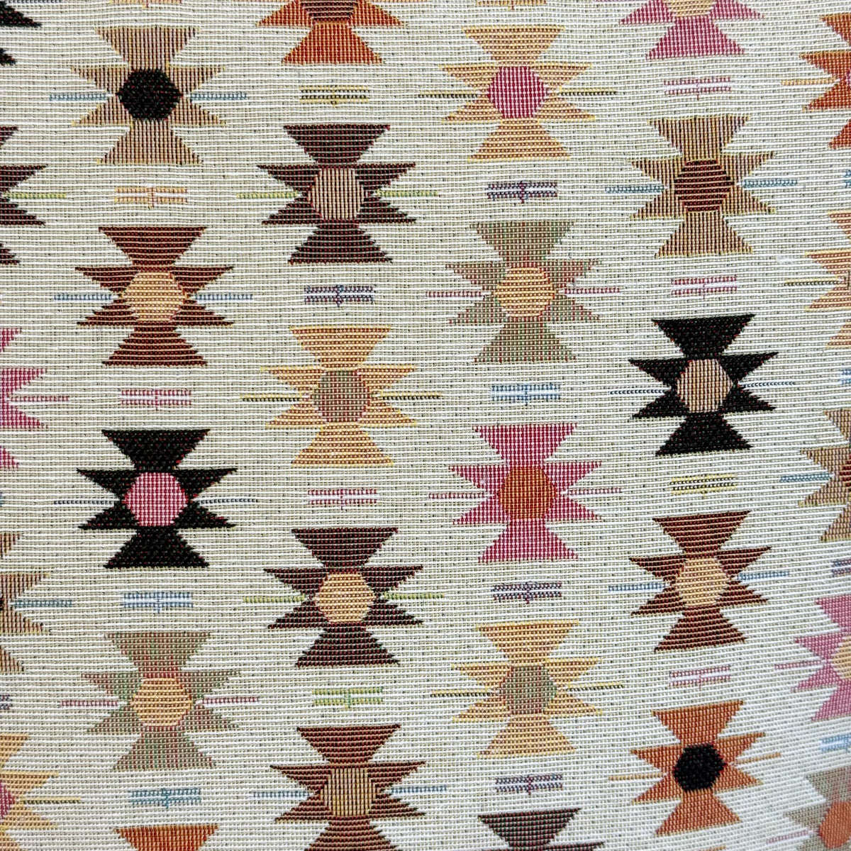 Close-up of the geometric jacquard fabric of the DE LA MUR Royal laptop bag