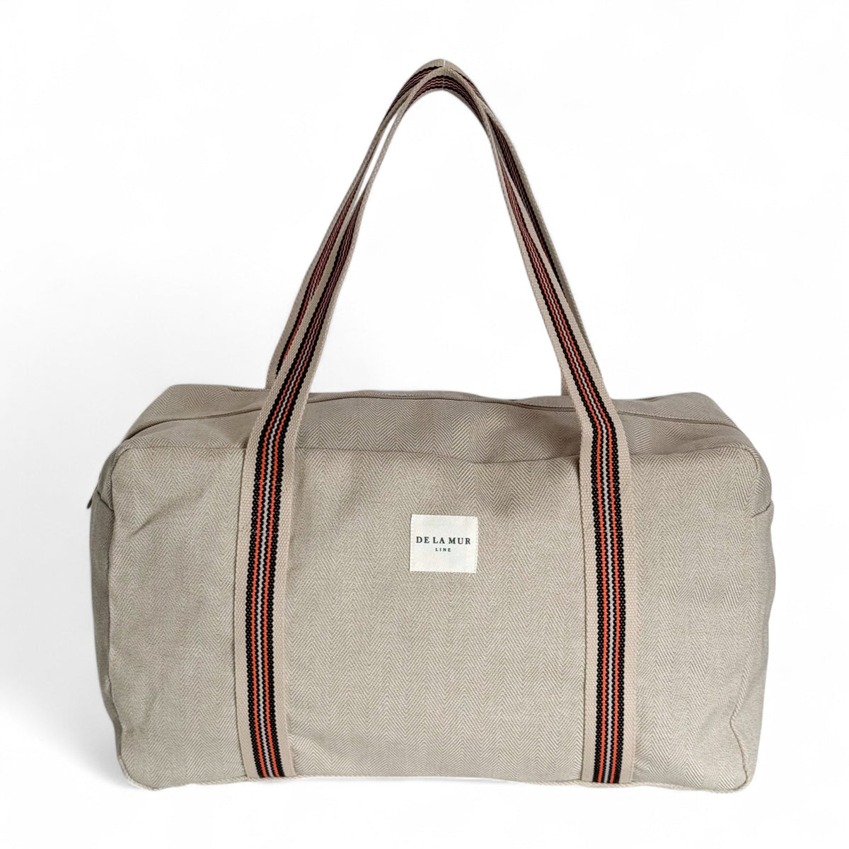 DE LA MUR Ivet herringbone sports bag in beige with striped straps, front view