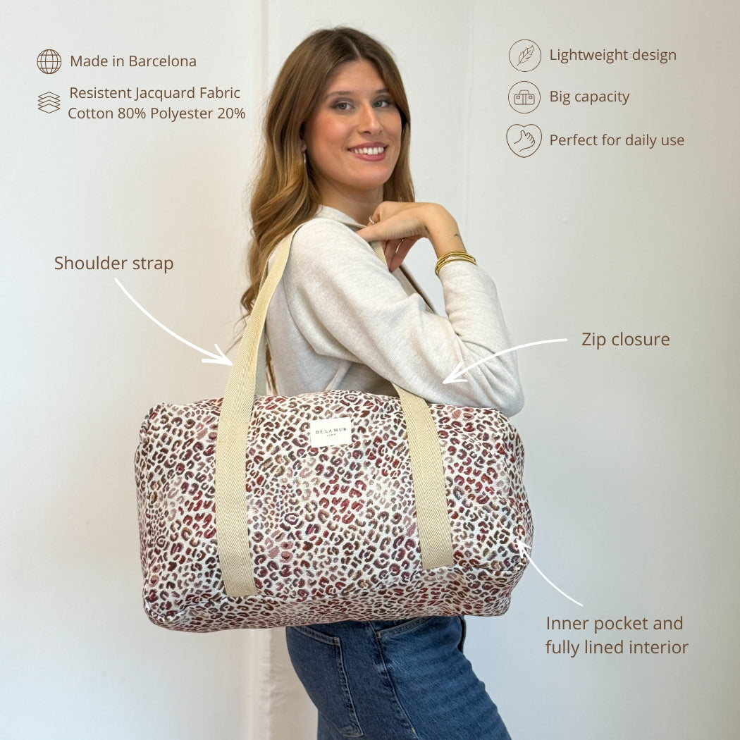 Model carrying DE LA MUR leopard jacquard sports bag with features infographic