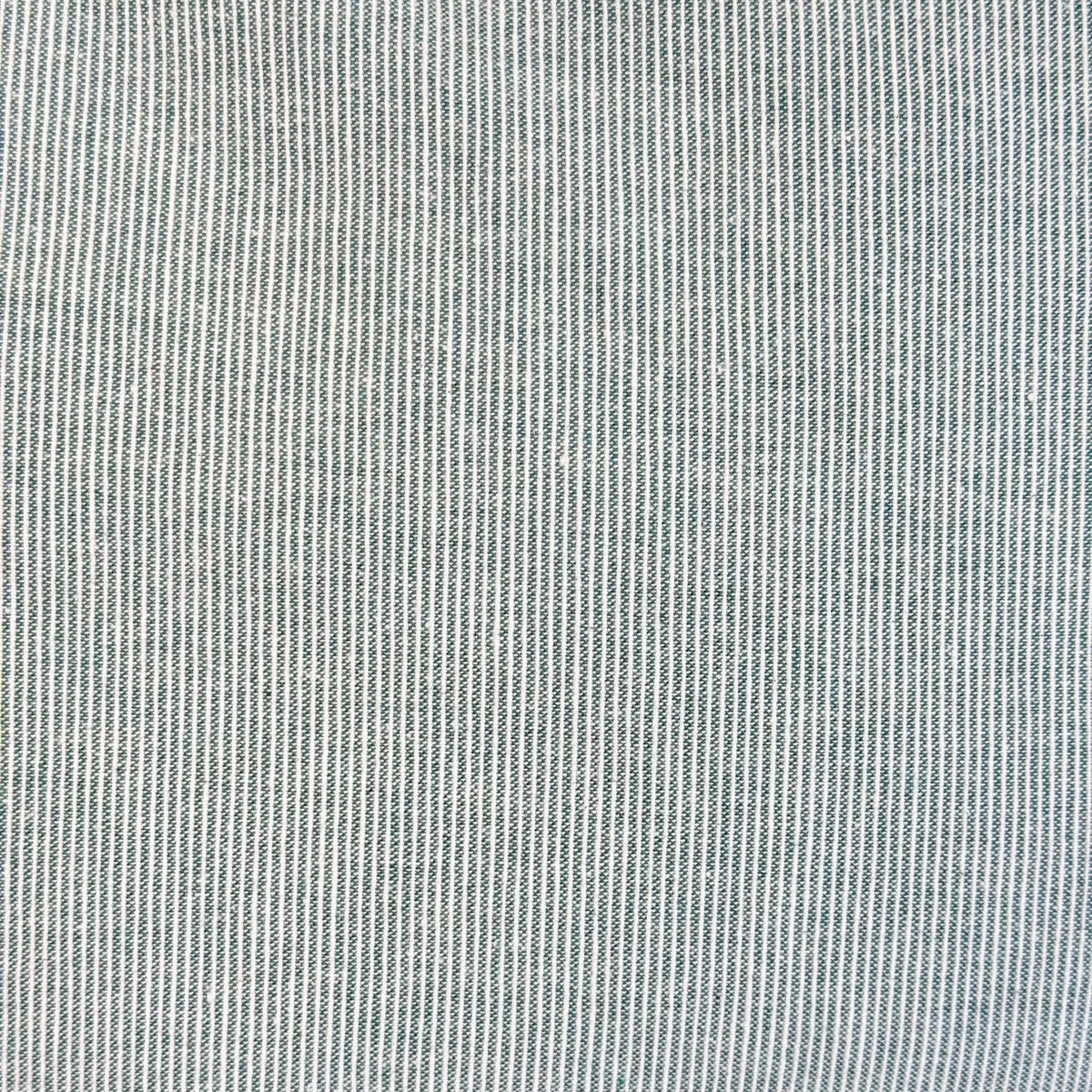 Close-up of the fine green and white textured stripe fabric of the DE LA MUR Teo tote