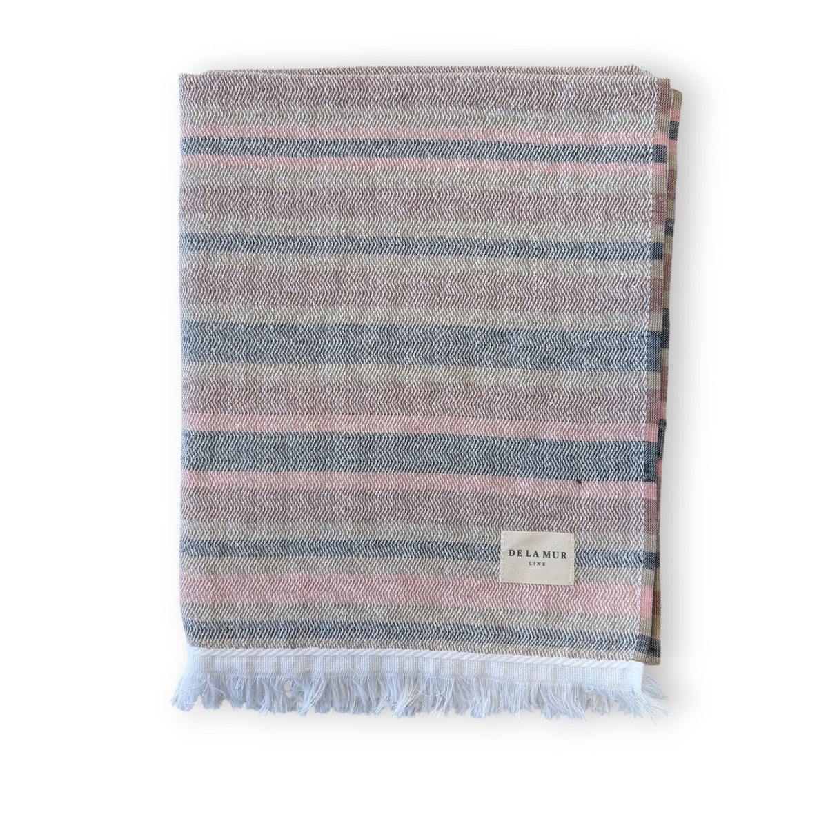 DE LA MUR striped towel in pink and grey, folded with fringed edge, front view